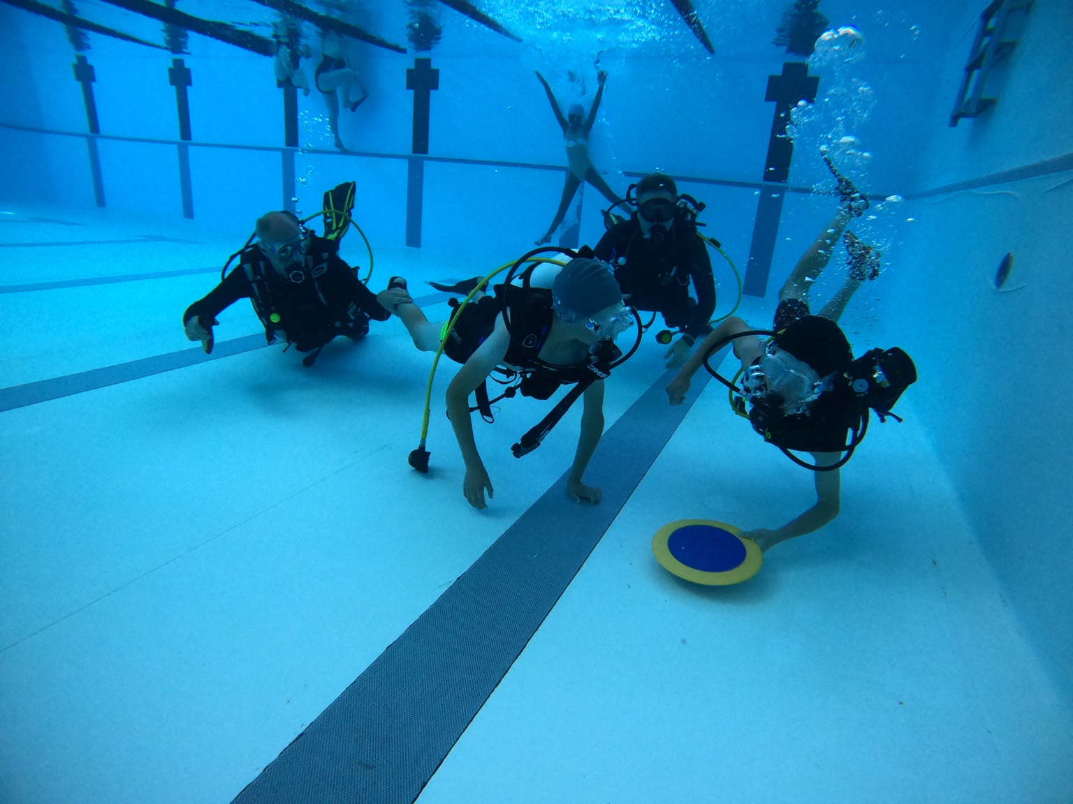 Group diving activity in the swimming pool